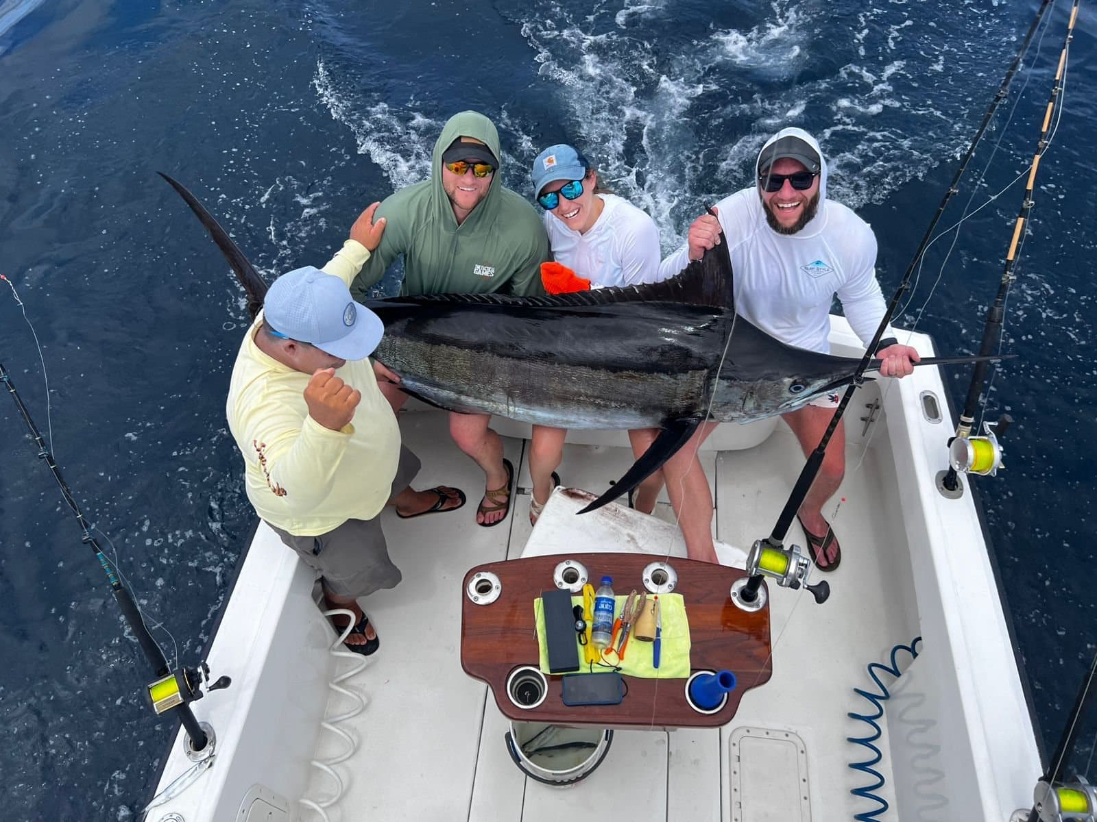 Anglers and crew with a billfish on the Predator's deck