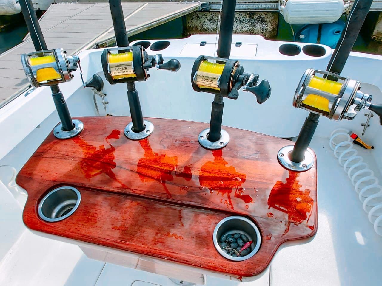Shimano reels in the Predator's varnished rod holder