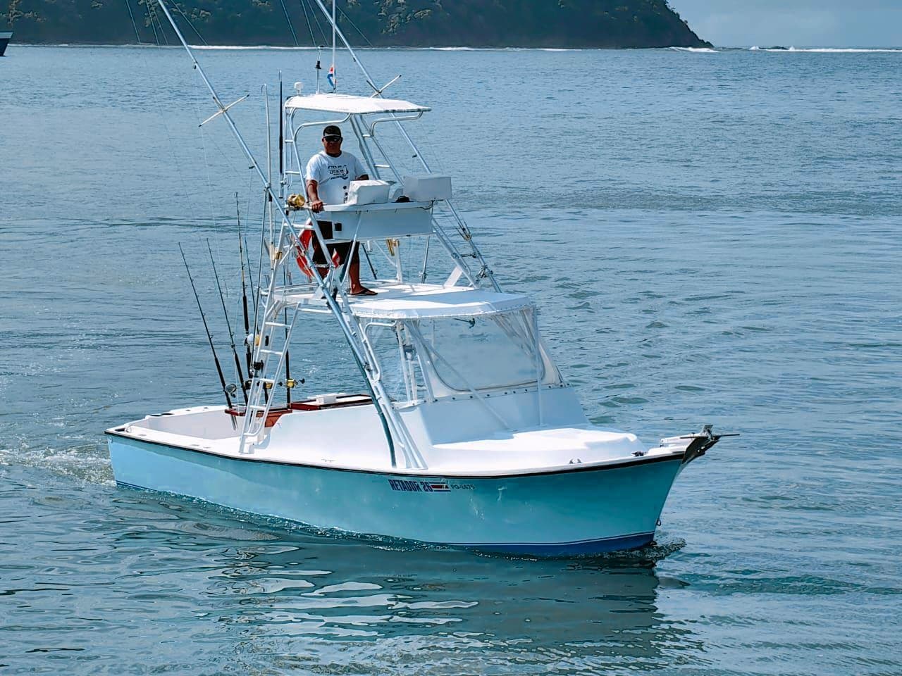 The Predator under way in Herradura Bay, with Capt. Luis at the tower helm